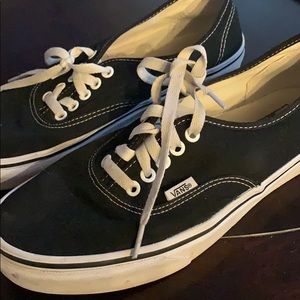 black Vans low tops